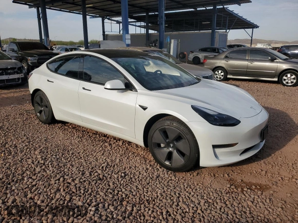 2021 Tesla Model 3 Standard Range Plus with VIN 5YJ3E1EA2MF923156, listed as a Copart auction lot 50098135 with 50,917 mi miles and Salvage Title. Bid and sale history available at carsss.com. Image 4.