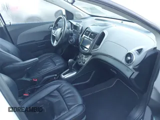 2016 Chevrolet Sonic LTZ z VIN 1G1JE6SB0G4161094, wystawiony jako IAAI lot #41890781 z przebiegiem 121 282 mil mil oraz . Historia ofert i sprzedaży dostępna na DreamBid. Obrazek 5.