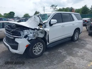 2021 Chevrolet Tahoe Commercial z VIN 1GNSKLEDXMR359932, wystawiony jako IAAI lot #42275551 z przebiegiem 24 mil mil oraz . Historia ofert i sprzedaży dostępna na DreamBid. Obrazek 2.