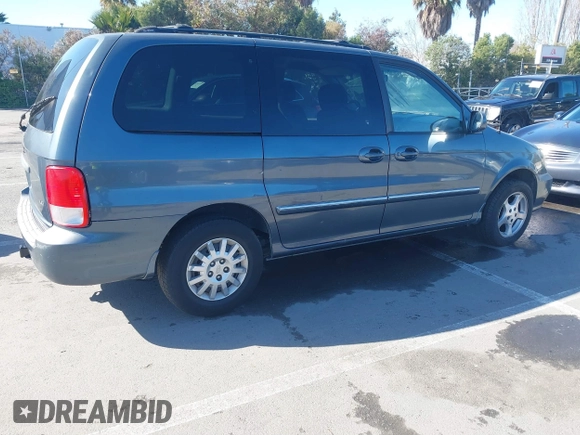2002 Kia Sedona LX with VIN KNDUP131826297204, listed as a IAAI auction lot 41510393 with 136,337 mi miles. Bid and sale history available at carsss.com. Image 4.