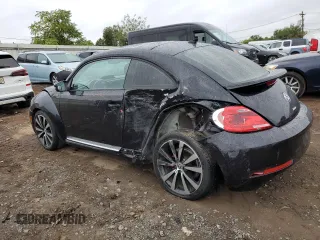 2014 Volkswagen Beetle Turbo R-Line with VIN 3VWVT7AT2EM603435, listed as a Copart auction lot 72755524 with 99,300 mi miles and Salvage Title. Bid and sale history available at DreamBid. Image 2.