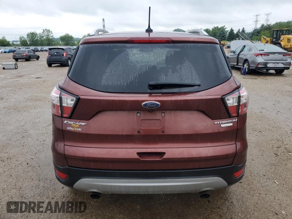 2018 Ford Escape Titanium z VIN 1FMCU0J93JUA70449, wystawiony jako Copart lot #59303245 z przebiegiem 165 907 mil mil oraz Szkoda całkowita • Salvage title. Historia ofert i sprzedaży dostępna na DreamBid. Obrazek 6.