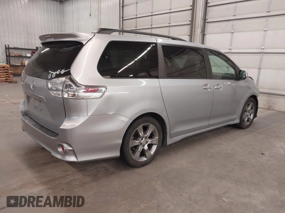 2015 Toyota Sienna SE with VIN 5TDXK3DC9FS527667, listed as a IAAI auction lot 41977729 with 230,933 mi miles and . Bid and sale history available at DreamBid. Image 4.