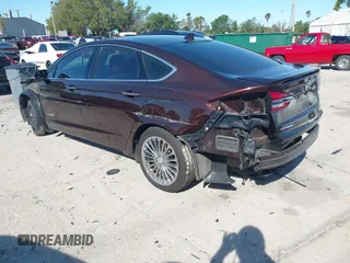2019 Ford Fusion Hybrid Titanium with VIN 3FA6P0RU2KR123786, listed as a IAAI auction lot 41857026 with 49,604 mi miles. Bid and sale history available at carsss.com. Image 3.
