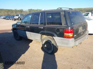 1998 Jeep Grand Cherokee Laredo with VIN 1J4FX58S7WC283734, listed as a IAAI auction lot 41267813 with 266,189 mi miles. Bid and sale history available at carsss.com. Image 3.