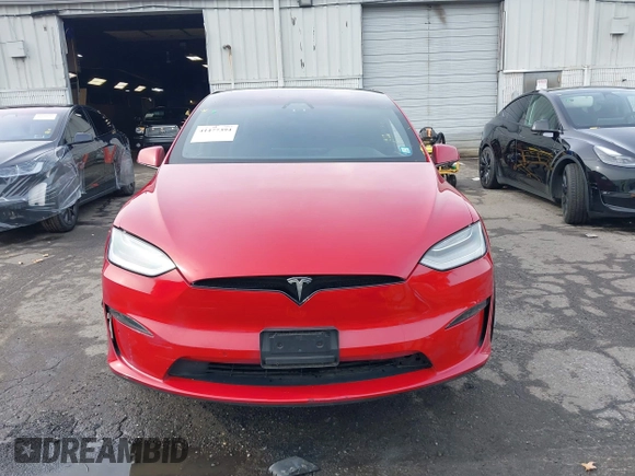 2022 Tesla Model X Plaid with VIN 7SAXCBE60NF330246, listed as a IAAI auction lot 41477394 with 51,612 mi miles and . Bid and sale history available at DreamBid. Image 12.