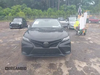 2023 Toyota Camry SE with VIN 4T1G11AKXPU827360, listed as a IAAI auction lot 42217356 with 57,497 mi miles and . Bid and sale history available at DreamBid. Image 12.