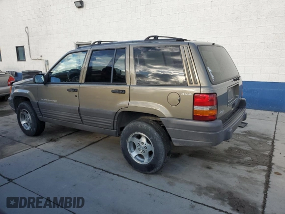 1996 Jeep Grand Cherokee Laredo with VIN 1J4GZ58S3TC245928, listed as a Copart auction lot 57313735 with 165,733 mi miles and Salvage title. Bid and sale history available at DreamBid. Image 2.