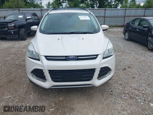 2016 Ford Escape Titanium z VIN 1FMCU9J90GUC76504, wystawiony jako IAAI lot #42552851 z przebiegiem 89 570 mil mil oraz . Historia ofert i sprzedaży dostępna na DreamBid. Obrazek 12.