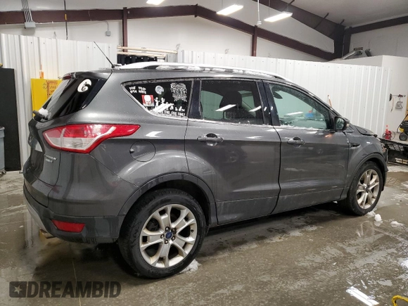 2015 Ford Escape Titanium with VIN 1FMCU9JX0FUA03009, listed as a Copart auction lot 50948755 with 133,748 mi miles and Salvage Title. Bid and sale history available at DreamBid. Image 3.