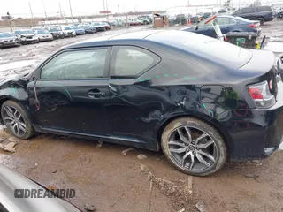 2014 Scion tC with VIN JTKJF5C74E3069104, listed as a IAAI auction lot 41579797 with 130,668 mi miles. Bid and sale history available at carsss.com. Image 14.