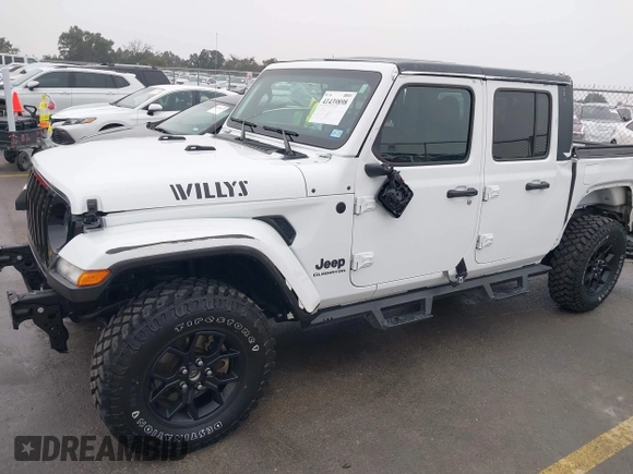 2021 Jeep Gladiator Willys with VIN 1C6HJTAG1ML575474, listed as a IAAI auction lot 41439898 with 44,335 mi miles and . Bid and sale history available at DreamBid. Image 18.