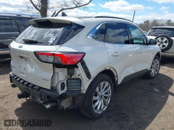 2021 Ford Escape Titanium with VIN 1FMCU9J94MUA27571, listed as a IAAI auction lot 42008938 with 32,592 mi miles and . Bid and sale history available at carsss.com. Image 4.
