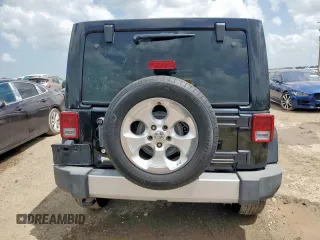 2015 Jeep Wrangler Unlimited Sahara with VIN 1C4BJWEG4FL668339, listed as a Copart auction lot 61221325 with 117,887 mi miles and Salvage title. Bid and sale history available at DreamBid. Image 6.