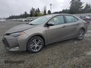 2019 Toyota Corolla L with VIN 2T1BURHE6KC220950, listed as a Copart auction lot 52231405 with 64,890 mi miles and Salvage Title. Bid and sale history available at DreamBid. Image 1.