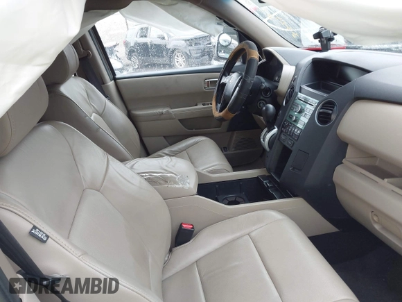 2011 Honda Pilot EX-L with VIN 5FNYF4H51BB076050, listed as a IAAI auction lot 42122883 with 143,288 mi miles and . Bid and sale history available at carsss.com. Image 5.