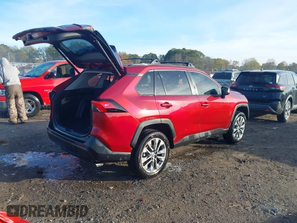 2021 Toyota RAV4 XLE Premium with VIN 2T3C1RFV1MW145048, listed as a IAAI auction lot 41018272 with 61,959 mi miles and . Bid and sale history available at DreamBid. Image 4.