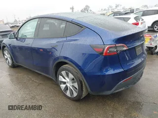 2022 Tesla Model Y Long Range with VIN 7SAYGDEE8NF511395, listed as a IAAI auction lot 41595310 with 65,156 mi miles and . Bid and sale history available at carsss.com. Image 3.