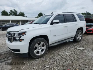 2015 Chevrolet Tahoe LT with VIN 1GNSKBKC1FR252874, listed as a Copart auction lot 60254765 with 180,949 mi miles and Salvage title. Bid and sale history available at DreamBid. Image 1.