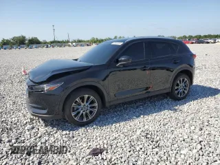 2021 Mazda CX-5 Signature with VIN JM3KFBEY5M0439676, listed as a Copart auction lot 52823285 with 41,811 mi miles and Non Repairable. Bid and sale history available at carsss.com. Image 1.