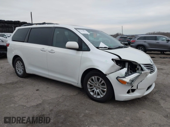 2015 Toyota Sienna XLE with VIN 5TDYK3DC9FS595827, listed as a IAAI auction lot 41014820 with 119,143 mi miles. Bid and sale history available at carsss.com. Image 1.