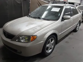 2001 Mazda Protege LX with VIN JM1BJ226710470935, listed as a IAAI auction lot 41577385 with 235,128 mi miles. Bid and sale history available at carsss.com. Image 17.
