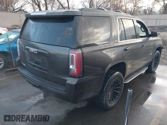 2015 GMC Yukon SLT with VIN 1GKS2BKC7FR110106, listed as a IAAI auction lot 41702260 with 108,679 mi miles. Bid and sale history available at carsss.com. Image 4.