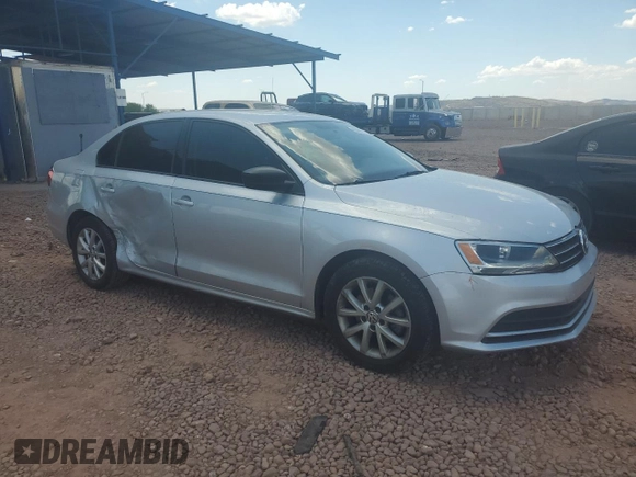 2015 Volkswagen Jetta SE with VIN 3VWD17AJ8FM265086, listed as a Copart auction lot 65084745 with 82,287 mi miles and Salvage title. Bid and sale history available at DreamBid. Image 4.