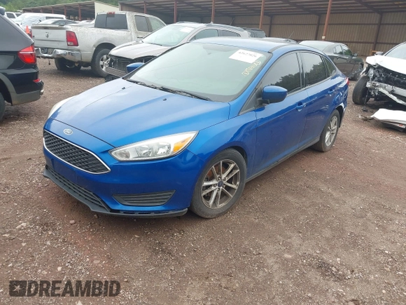 2018 Ford Focus SE with VIN 1FADP3F26JL212866, listed as a IAAI auction lot 42627026 with 211,072 mi miles and . Bid and sale history available at DreamBid. Image 2.