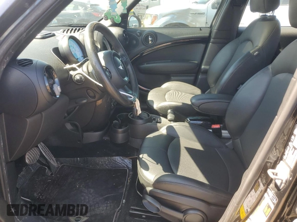 2013 MINI Countryman S ALL4 z VIN WMWZC5C54DWP34353, wystawiony jako Copart lot #57059295 z przebiegiem 154 012 mil mil oraz Szkoda całkowita • Salvage title. Historia ofert i sprzedaży dostępna na DreamBid. Obrazek 7.
