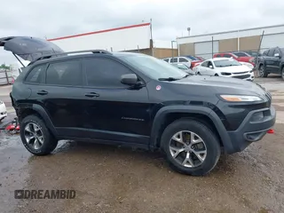 2015 Jeep Cherokee Trailhawk with VIN 1C4PJMBS5FW647601, listed as a IAAI auction lot 42437734 with 170,640 mi miles and . Bid and sale history available at DreamBid. Image 14.