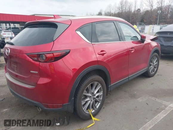 2020 Mazda CX-5 Grand Touring with VIN JM3KFADMXL0842026, listed as a IAAI auction lot 41477339 with 60,755 mi miles. Bid and sale history available at carsss.com. Image 4.