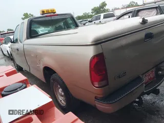 1999 Ford F-150 z VIN 1FTZX1727XNC32012, wystawiony jako IAAI lot #42503195 z przebiegiem 1 805 469 mil mil oraz . Historia ofert i sprzedaży dostępna na DreamBid. Obrazek 3.