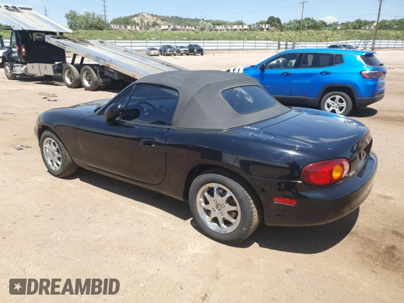 1999 Mazda MX-5 Miata with VIN JM1NB3535X0119662, listed as a Copart auction lot 61870445 with 84,787 mi miles and Clean title. Bid and sale history available at DreamBid. Image 2.
