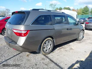 2012 Honda Odyssey LX with VIN 5FNRL5H29CB091860, listed as a IAAI auction lot 42000688 with 295,551 mi miles. Bid and sale history available at carsss.com. Image 4.