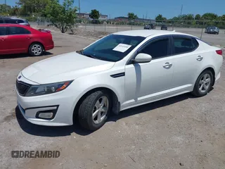 2015 Kia Optima LX z VIN KNAGM4A79F5530434, wystawiony jako IAAI lot #42145100 z przebiegiem 171 477 mil mil oraz . Historia ofert i sprzedaży dostępna na DreamBid. Obrazek 2.