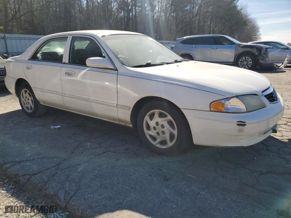 2001 Mazda 626 LX with VIN 1YVGF22C815240640, listed as a Copart auction lot 47609315 with 0 mi miles and Salvage Title. Bid and sale history available at carsss.com. Image 4.
