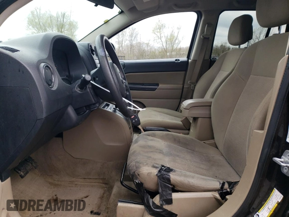 2014 Jeep Compass Sport with VIN 1C4NJDBB9ED670610, listed as a Copart auction lot 52691825 with 150,525 mi miles and Salvage Title. Bid and sale history available at carsss.com. Image 7.