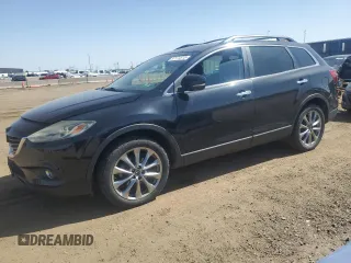2015 Mazda CX-9 Grand Touring z VIN JM3TB3DA3F0449202, wystawiony jako Copart lot #57174515 z przebiegiem 159 635 mil mil oraz Czysty tytuł • Clean title. Historia ofert i sprzedaży dostępna na DreamBid. Obrazek 1.