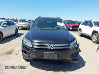 2015 Volkswagen Tiguan SE with VIN WVGAV7AX1FW558855, listed as a IAAI auction lot 42064427 with 58,584 mi miles and . Bid and sale history available at DreamBid. Image 12.