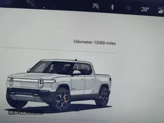 2022 Rivian R1T Adventure Package with VIN 7FCTGAAA1NN012328, listed as a IAAI auction lot 41307929 with 13,588 mi miles. Bid and sale history available at carsss.com. Image 7.