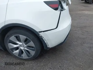2022 Tesla Model Y Long Range z VIN 7SAYGDEE7NF389788, wystawiony jako IAAI lot #42014111 z przebiegiem 37 606 mil mil oraz . Historia ofert i sprzedaży dostępna na DreamBid. Obrazek 21.