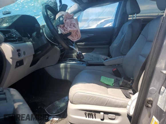 2021 Honda Pilot EX-L z VIN 5FNYF5H58MB008921, wystawiony jako Copart lot #56985395 z przebiegiem Nie podano mil oraz Szkoda całkowita • Salvage title. Historia ofert i sprzedaży dostępna na DreamBid. Obrazek 7.