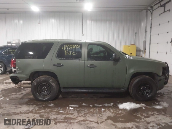 2014 Chevrolet Tahoe Commercial with VIN 1GNSK2E05ER196941, listed as a IAAI auction lot 41938892 with 176,170 mi miles and . Bid and sale history available at DreamBid. Image 14.