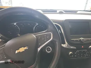 2020 Chevrolet Equinox LT with VIN 2GNAXJEV0L6236404, listed as a IAAI auction lot 42619695 with 77,124 mi miles and . Bid and sale history available at DreamBid. Image 4.
