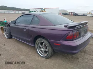 1996 Ford Mustang with VIN 1FALP404XTF174880, listed as a IAAI auction lot 41774122 with 285,302 mi miles. Bid and sale history available at carsss.com. Image 3.