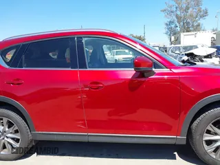 2021 Mazda CX-5 Grand Touring with VIN JM3KFADM5M0470483, listed as a IAAI auction lot 42785031 with 30,749 mi miles and . Bid and sale history available at DreamBid. Image 13.