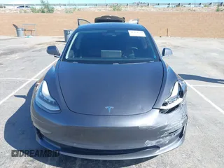2019 Tesla Model 3 Mid Range with VIN 5YJ3E1EA6KF307456, listed as a IAAI auction lot 41944454 with 99,059 mi miles and . Bid and sale history available at DreamBid. Image 11.