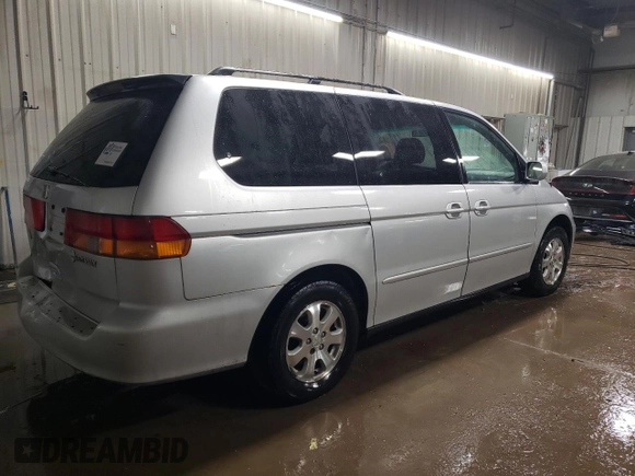 2004 Honda Odyssey EX-L with VIN 5FNRL189X4B098131, listed as a Copart auction lot 47294865 with 196,581 mi miles and Salvage Title. Bid and sale history available at DreamBid. Image 3.