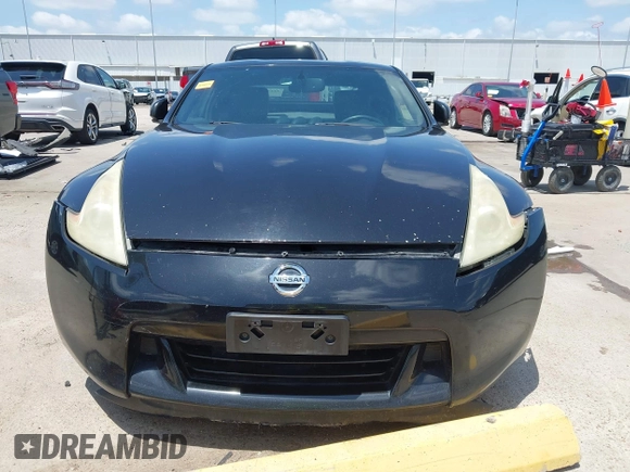 2012 Nissan 370Z z VIN JN1AZ4EH1CM564630, wystawiony jako IAAI lot #42177880 z przebiegiem 173 751 mil mil oraz . Historia ofert i sprzedaży dostępna na DreamBid. Obrazek 13.